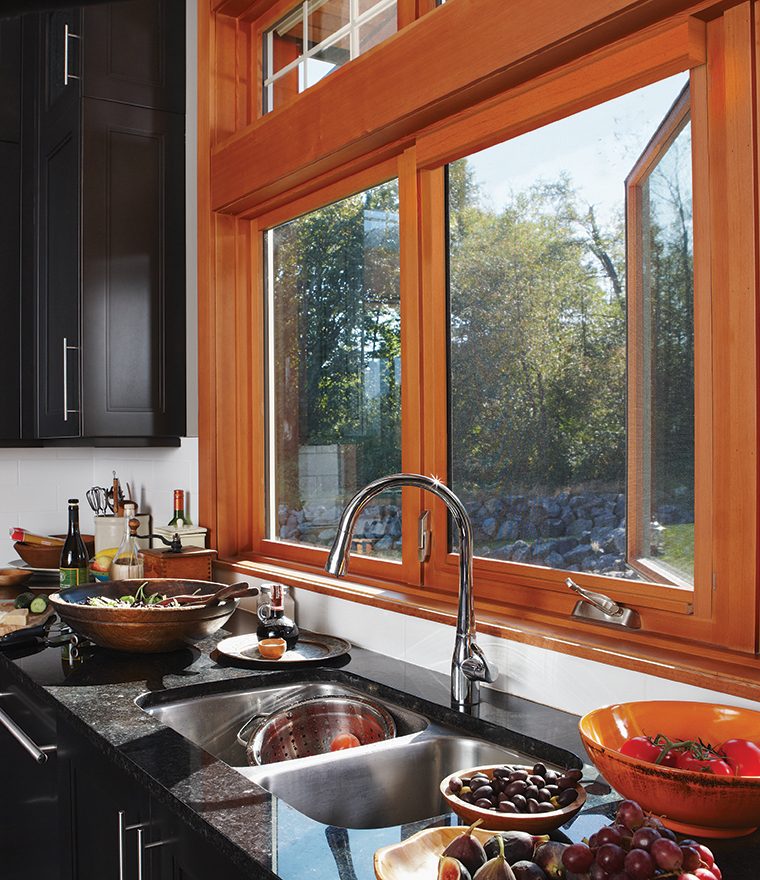 Disappearing window screens on wooden window over kitchen sink