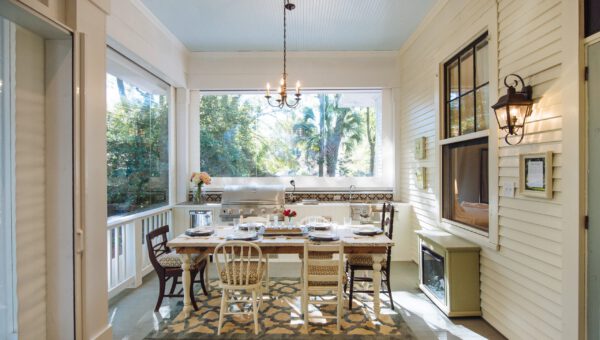 Southern home back porch with dining table and motorized Phantom retractable screens