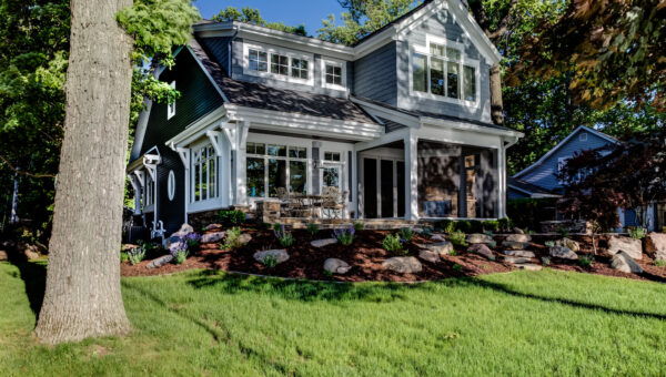 American home with rolled down motorized screen porch