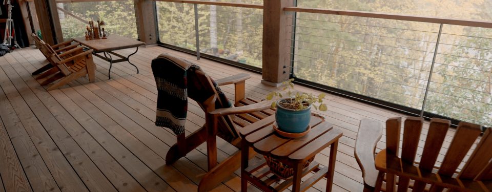 Close up of patio chairs on wooden decking